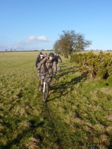 Seb leading the pack through the fields on the Ceiriog Trail.     